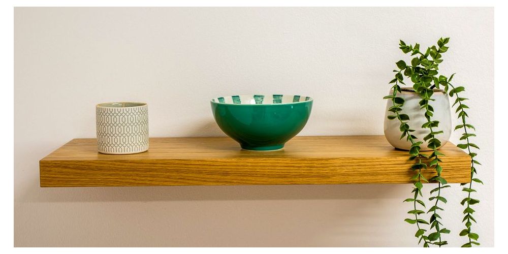 Oak Veneer Floating Shelf with a candle, bowl and planter placed on  it