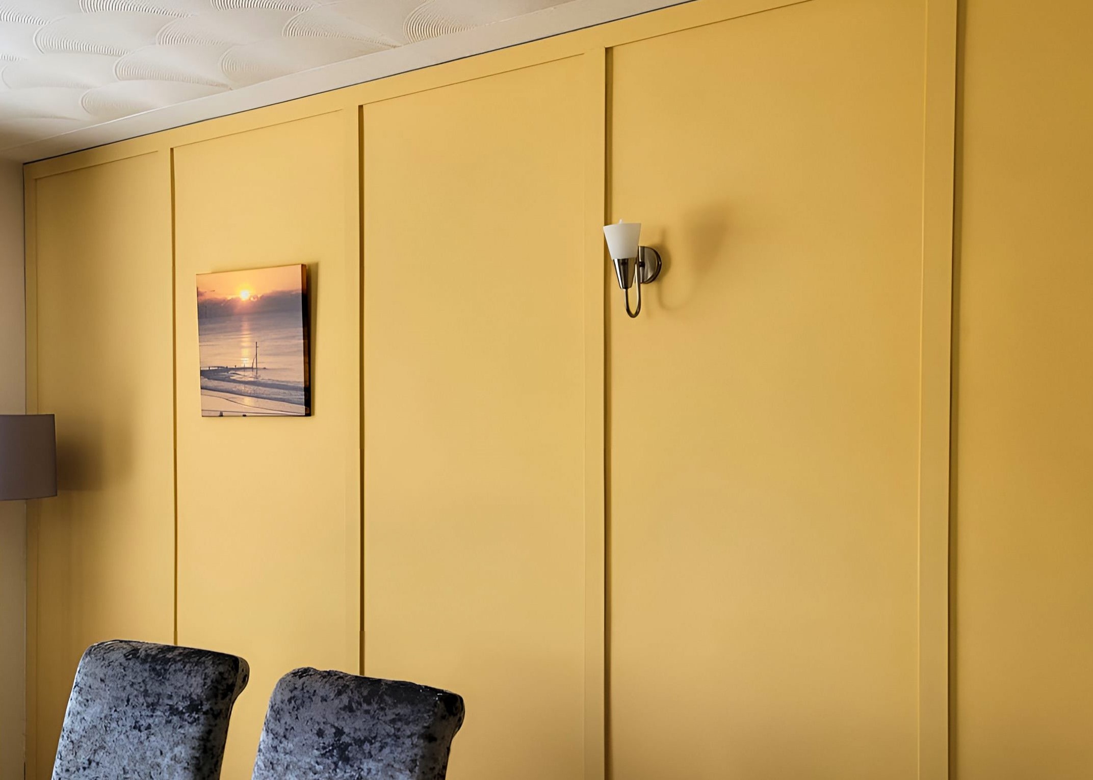 mustard yellow shaker wall panel in dining room