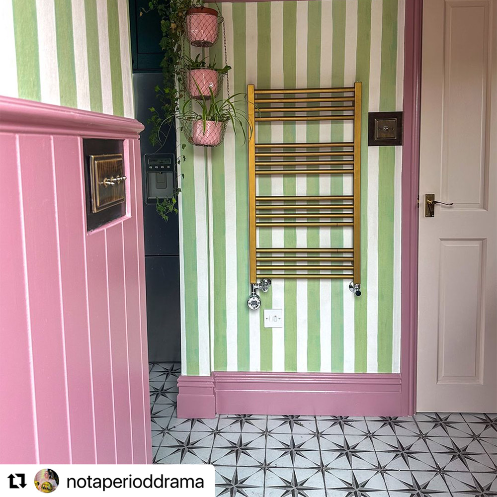 Pink tongue and groove half height wall panelling with a dado